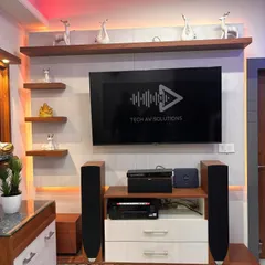 Here is a 7.2.2 home theater system I installed in a living room, built around a 55 inch LG TV. The setup includes Jamo speakers and a Denon AV receiver, creating a powerful surround sound experience that works beautifully within the existing TV unit.