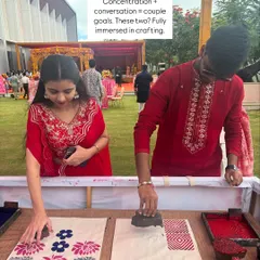 A creative date at a wedding. I love seeing couples get completely immersed in the printing process together, sharing ideas and creating matching tote bags. It's a wonderful way to connect and make a shared memory during the celebration.