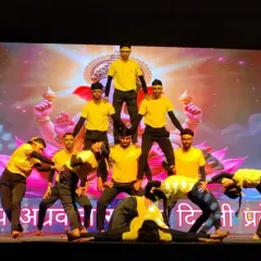 A human pyramid built on a foundation of strength and trust. This is the culmination of hours of practice and shows what children can achieve when they work together.
