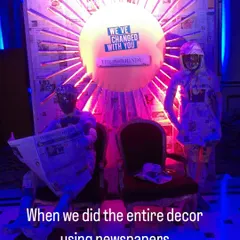 A wider view of our newspaper installation for 'The Hindu' event. The setup included two life-sized figures and a large, sun-like backdrop, all crafted from recycled newspapers to fit the theme.