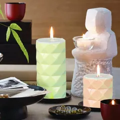 See how my diamond-cut pillar candles create a beautiful ambiance. Their geometric texture catches the light, making them a stunning centerpiece.