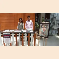 My professional stall at the Radisson Blu. I come with my own easel, table, and display art, making the setup process completely hassle-free for the event organizers.