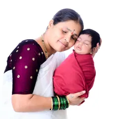A moment of pure peace and love between a grandmother and her newborn grandchild. Her gentle hug and serene expression make this a truly heartwarming family portrait.