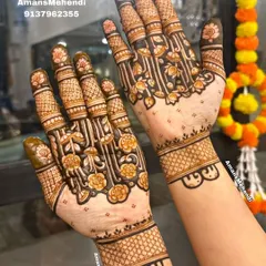 A beautiful example of a 'half-jaal' or net design on the palms, where a floral vine pattern creates a sense of fullness while still feeling light.