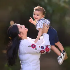 The pure happiness of a mother lifting her son into the air. I encourage playful interactions like this to capture dynamic photos filled with genuine emotion and beautiful natural light.