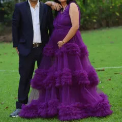 Our purple ruffle maternity gown is designed for both style and comfort. The layers of tulle create a beautiful, full look for your photoshoot.