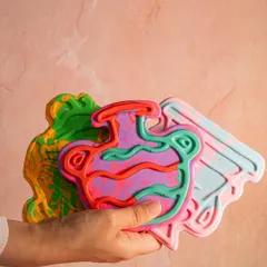 A handful of my colorful, handcrafted soap bars. I make them with natural, toxin-free ingredients, and each one has a unique, artistic design.