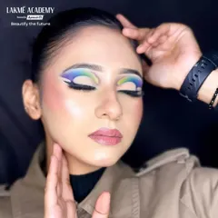 A different angle of the colorful glam makeup, showcasing the flawless skin finish and soft contour. We teach our students to perfect the base, as it's the foundation of any great makeup look.