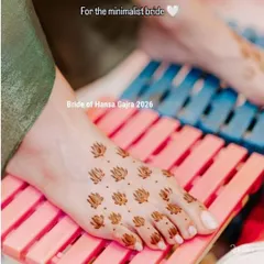 Minimal mehendi for the feet. This simple yet beautiful design features small lotus motifs scattered across the foot, creating a delicate and modern look.