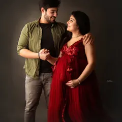 The bond between a sister and brother is so special. Here, the brother-to-be holds his pregnant sister's hand, sharing a happy and supportive moment.