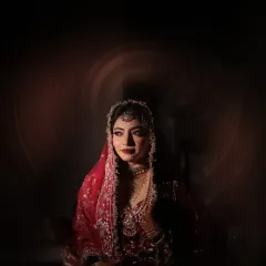 A bride's portrait is more than a picture; it's poetry. I love to play with shadow and light to create moody, artistic shots that capture the depth and grace of the moment before she walks down the aisle.