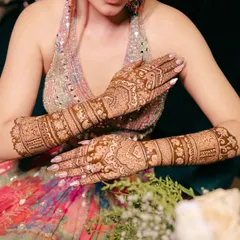A detailed shot of the bride's intricate Mehendi design, showcasing the beautiful artistry that is such an important part of the wedding celebrations.