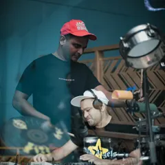 A behind the scenes look at the synergy between DJ and percussionist. Here, I'm focused on the mix while my partner gets ready to layer in the live drum beats that define our "Wakanda boys" sound.
