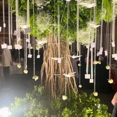 A closer look at our custom-built "Wish Tree." We hung crystals, acrylic birds, and personalized wish cards from its branches, creating an interactive and meaningful centerpiece for the reception.