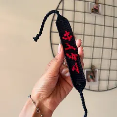 A custom friendship bracelet for a "One-Punch Man" fan, featuring Saitama's name in Japanese characters. I love bringing your unique ideas to life.