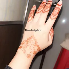 The beautiful light orange stain of the delicate floral vine design, pictured shortly after the paste has been removed. This color will deepen into a rich maroon over the next two days.