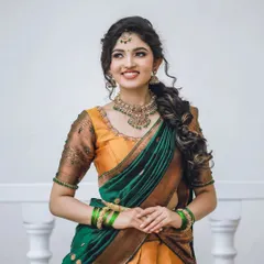 This is my modern take on the traditional half-saree, a beautiful Langa Voni. The combination of mustard yellow and emerald green silk is perfect for festive occasions or a bridesmaid's outfit, blending tradition with a fresh, contemporary style.