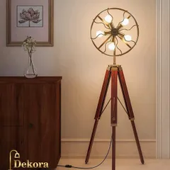 Make a bold statement with this unique fan-shaped tripod lamp. Featuring five exposed bulbs in a circular brass frame, this piece is functional art, ideal for industrial or eclectic interiors that need a conversation starter.