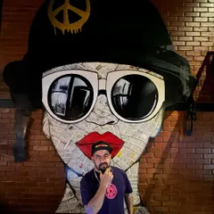 Posing in front of some cool street art. The visual culture is a big part of the vibe I curate.