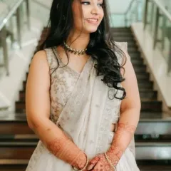 Fresh and radiant for the bride's sister. This soft glam look enhances her natural features, giving her a timeless glow that's perfect for wedding photos.