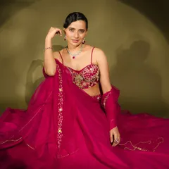 This shot from a fashion series shows a modern take on bridal glamour. The sleek, side-parted hair and diamond jewellery are paired with a makeup look that is both sophisticated and striking.
