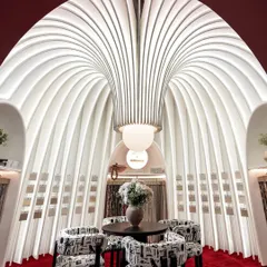 This was our ode to the silent power of fabric. For this award-winning exhibition booth, we sculpted a sanctuary from sheer white fins and soft light, creating a space that felt like walking through a poem. The structure itself became the art, inviting visitors into a serene, elegant world.