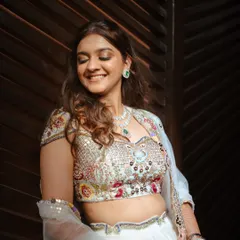 This bride is glowing for her Sangeet. I created a soft glam look with a hint of shimmer on the eyes and dewy skin that catches the light beautifully.