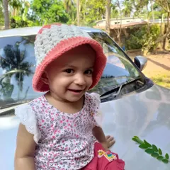 My daughter wearing the Bonnie Bell Sunhat. It’s made from cotton, so it’s breathable for sunny days, and the wide brim provides great shade.
