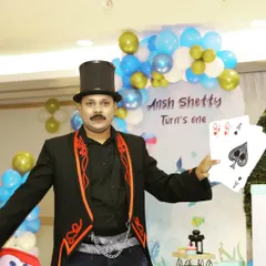 Displaying a royal flush during a card manipulation routine. I perform with both regular and jumbo-sized cards to make sure the magic is visible to everyone.