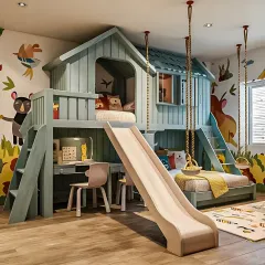 We love bringing imagination to life with our kids' room theme decor. This custom-built treehouse bunk bed includes a slide, a study nook underneath, and playful wall decals, creating a fun and functional space for children.