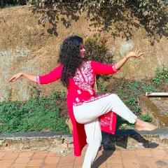 A dynamic semi-classical pose captured in Coorg. The movement in my kurta and the active posture show how this dance form combines the structure of classical with the freedom of contemporary styles.