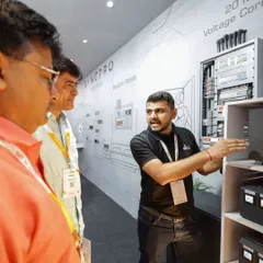An engineer from our team explaining the technical specifications of a control panel to interested visitors at the Smart Home Expo. We are always ready to dive into the details.