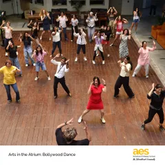 An overhead view of our 'Arts in the Atrium' Bollywood dance event. The atrium becomes a stage where our entire community, including students, staff, and parents, can come together to celebrate movement and culture.