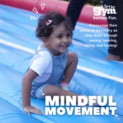 Every part of our gym is designed to encourage discovery. This joyful toddler is learning through doing and feeling as she enjoys a slide, a simple activity that enhances body awareness.