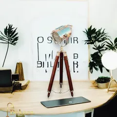 A miniature version of our popular floor-standing focus lights, this wooden tripod desk lamp is perfect for your workspace. It provides direct, adjustable light while adding a touch of nautical or industrial charm.