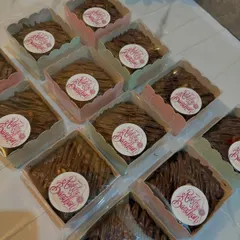 These individual brownies were made as special treats for Raksha Bandhan. Each one is drizzled with chocolate and packed in its own box with a festive sticker.