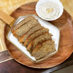 My protein-packed lentil bread served with a homemade creamy cashew cheese dip. This combination is simple, elegant, and absolutely delicious, without any flour, butter, or oil.