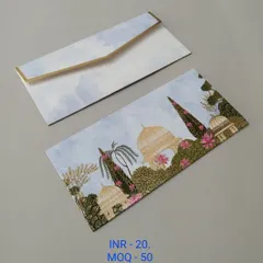 A soft pink envelope with faint silhouettes of palace domes and hanging temple bells in gold foil. This design is perfect for those who want a traditional yet understated look.