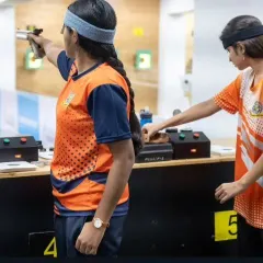 Teamwork and individual focus go hand in hand. Two of our female pistol shooters practice side-by-side, pushing each other to improve with every shot.