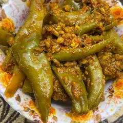 For those who love a spicy kick, my Bharwa Mirchi is a must-try. These are large green chillies stuffed with a flavourful masala mix, pickled in oil to preserve their taste and texture.