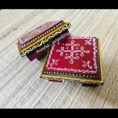 These are my hand-painted Pooja Chowkis, or small pedestals for placing deities or diyas. They are made from MDF wood and feature traditional South Indian kolam designs on a rich red background.