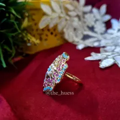 A side view of the 'Anokhi' ring, showing its impressive size and detailed craftsmanship.