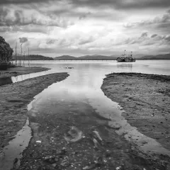 A quiet scene from Gokarna in 2012, showing the Aghanashini river meeting the sea. The black and white conversion gives it a classic, documentary feel, reflecting a time before it became a major tourist spot.