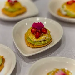 A crowd favourite, our Avocado Papdi Chaat. We layer creamy avocado mousse on a crisp papdi with sweet curd and a tangy plum gel for a fusion of textures and flavours.