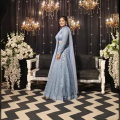 A stunning sangeet night look. This powder blue lehenga is fully adorned with sequins, creating a dazzling effect under the lights. It's designed for the woman who loves to sparkle.