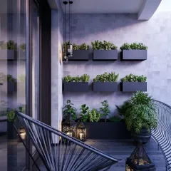 This modern balcony design uses wall-mounted planters to create a vertical herb garden. The sleek, minimalist furniture and dark color palette give the space a sophisticated and contemporary feel.
