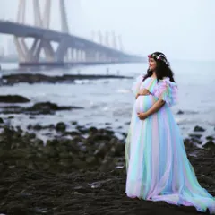 My Unicorn Gown is a whimsical and popular choice for maternity shoots. The layers of pastel-colored tulle create a soft, ethereal effect that photographs beautifully, especially in natural light by the sea.