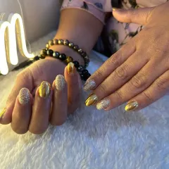 Another angle of the gold chrome and glitter set. The combination of metallic foil and textured glitter creates a rich, multi-dimensional effect.