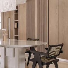The dining area features a monolithic white marble table we designed, surrounded by elegant chairs. The fabric light fixture above adds a soft, diffused glow to the space.