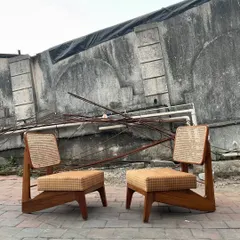 A pair of my handcrafted Pierre Jeanneret-inspired low lounge chairs, made from solid teak with cane backrests and upholstered seats.